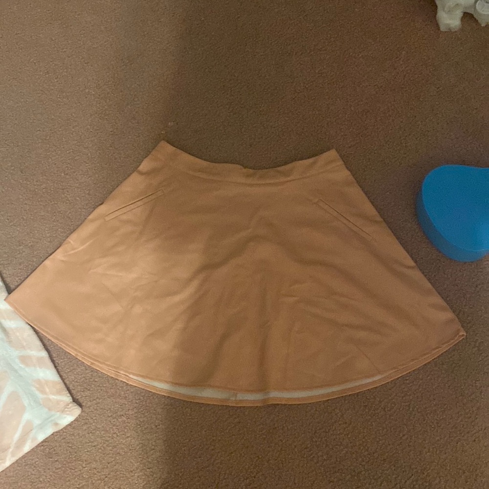 Faux leather peach/coral colored boho inspired flare skirt.
